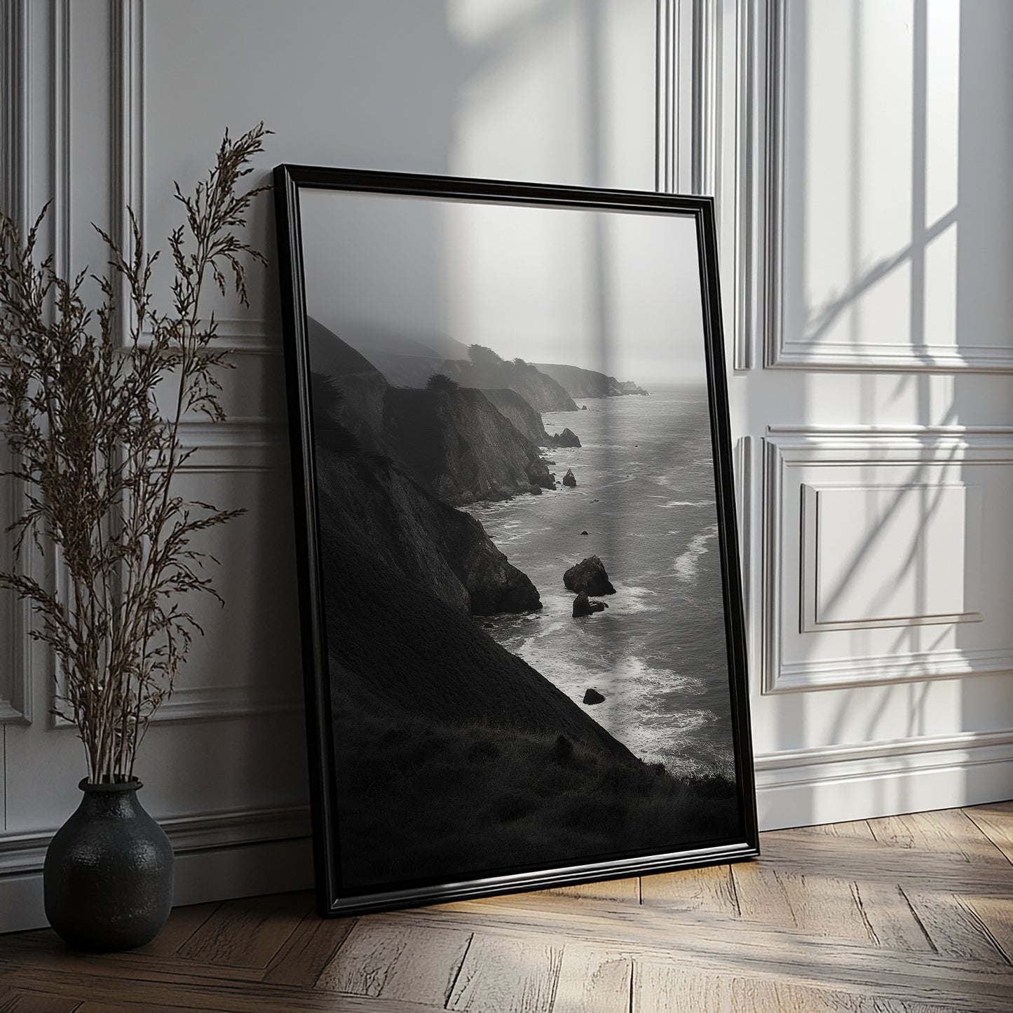 Black and white ocean landscape print featuring steep cliffs and a calm gray horizon.